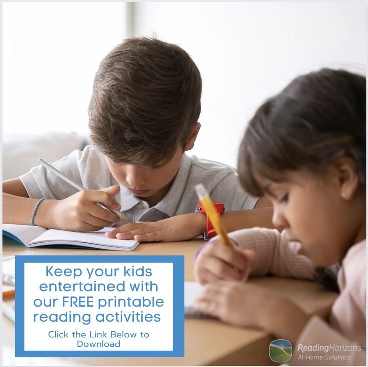 Two Children Are Sitting At A Table With Books And Pencils In Front Of Them