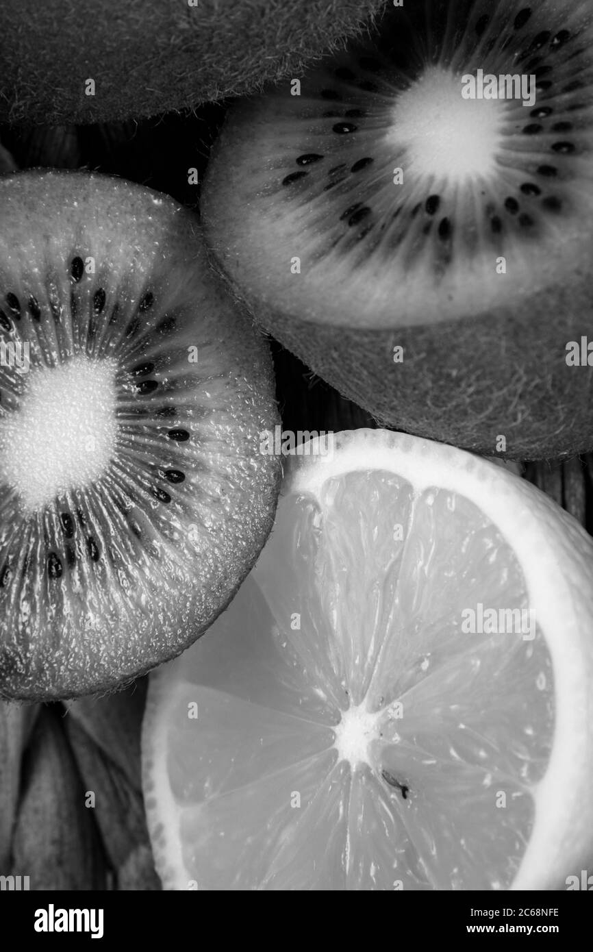 Black And White Fruit Photography Of Some Chopped Lemons And Kiwis 