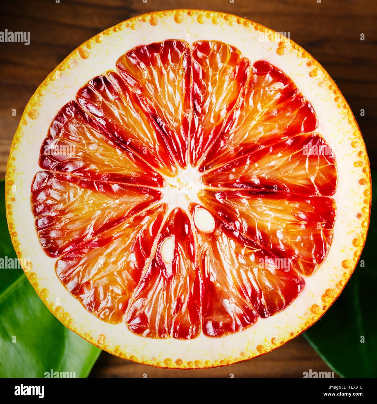 Ripe Juicy Half Of An Orange Citrus Fruit Close Up On Wooden 
