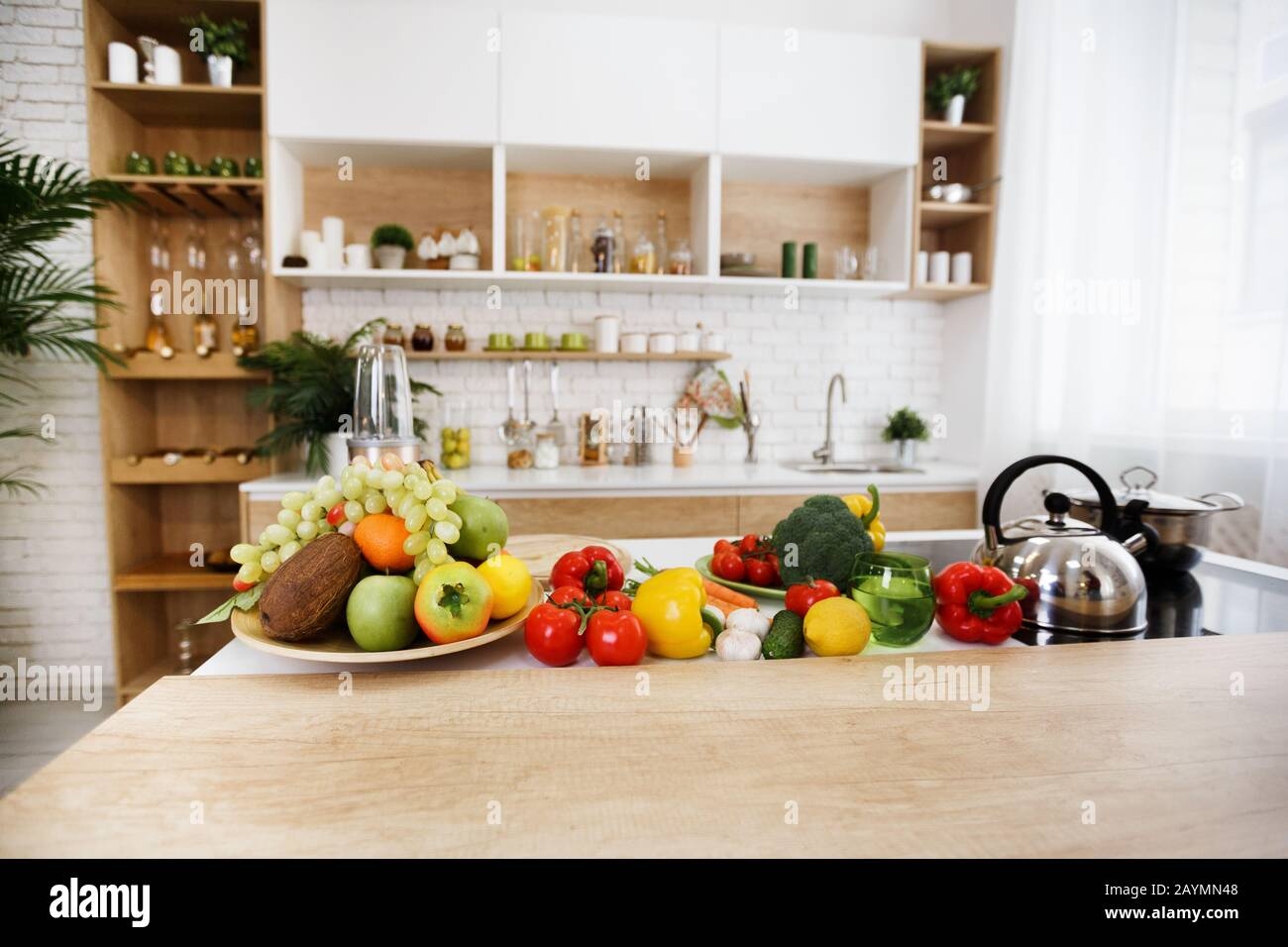 Kitchen Interior Fresh Fruits And Vegetables On Table Stock Photo Alamy