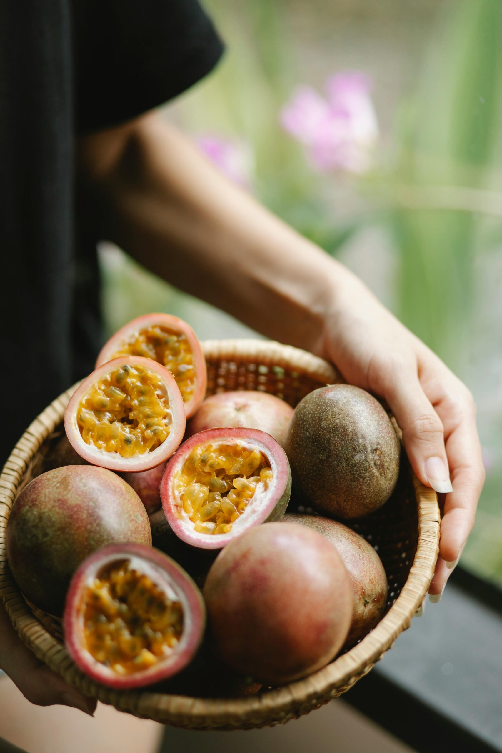 Woman With Fresh Passion Fruit In Bowl Free Stock Photo